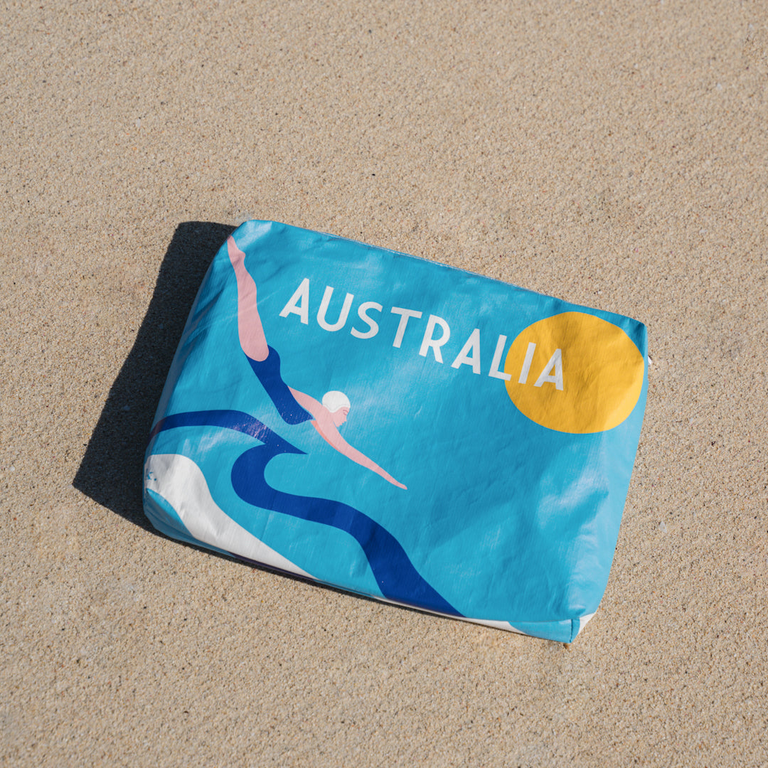 Australia beach bag water resistant blue wave ocean yellow sun swan diving at the beach on the sand wet bag