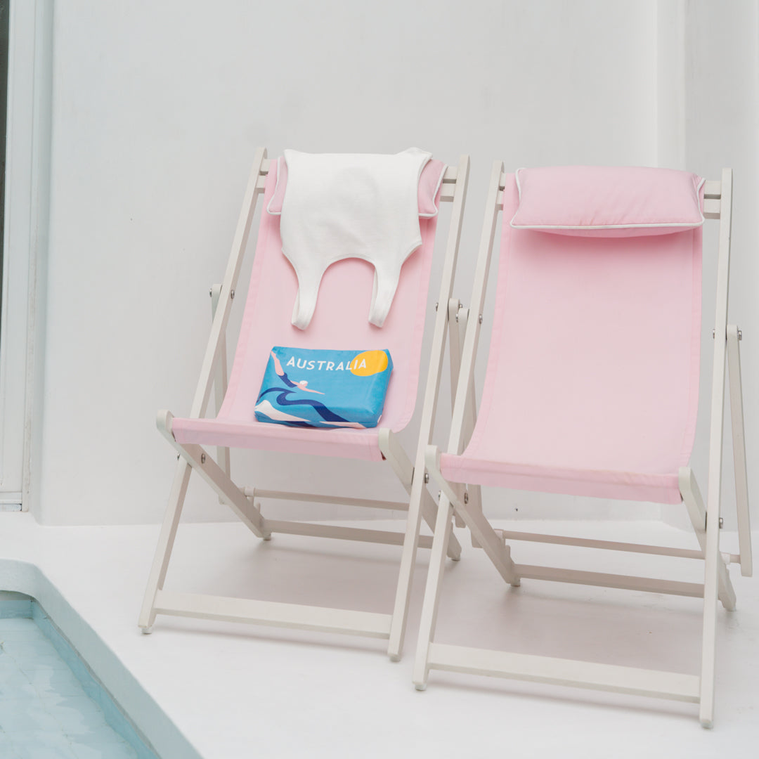 Poolside wet bag for wet swimmers white swimming costume pink deck chair travel bag for holidays